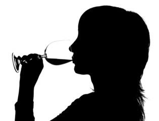 Silhouette of the woman drinking red wine