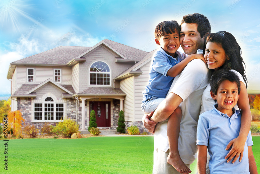 Happy family portrait in front of house Stock Photo | Adobe Stock