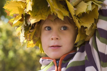 little boy with chaplet of yellow leaves