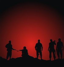 Soldiers Silhouettes Standing Against Sunset Background