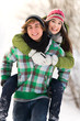 © pikselstock - Man giving woman piggyback