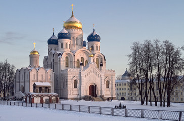 Wall Mural - evening winter landscape with church.