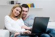© Rido - Young couple with laptop at home