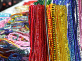 Fototapeta  - A lot of colored glass necklaces in the oriental style