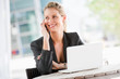 © EastWest Imaging - Businesswoman with Phone and Laptop