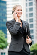 © EastWest Imaging - Businesswoman with Phone and File