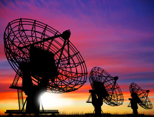 satellite dishes over sunset