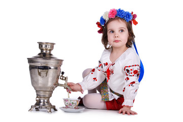 Pretty little girl near the samovar