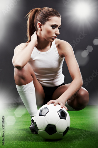 Naklejka ścienna Sexy soccer player, woman on playing field