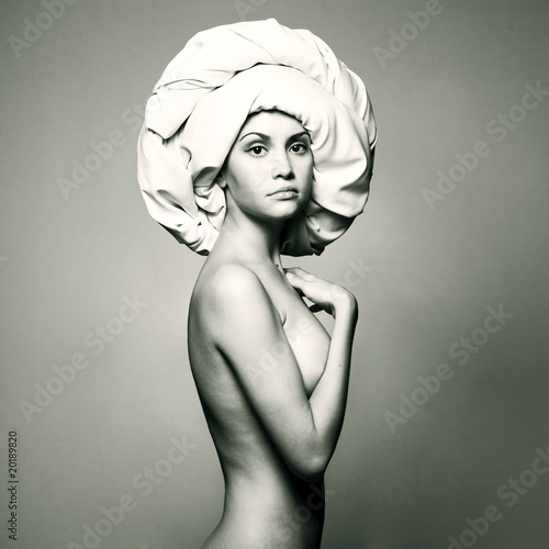 Fototapeta na wymiar Nude woman in fashionable turban