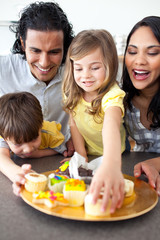 Wall Mural - Jolly family eating cookies