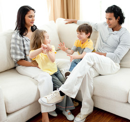 Canvas Print - Lively family having fun in the living room