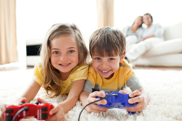 Wall Mural - Loving siblings playing video game