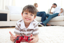 Smiling Little Boy Playing Video Games