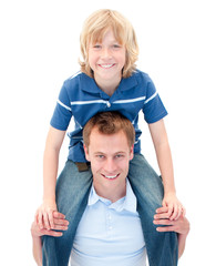 Wall Mural - Close-up of  father giving his son piggyback ride