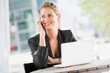 © EastWest Imaging - Businesswoman with Phone and Laptop