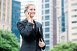 © EastWest Imaging - Businesswoman with Phone and File