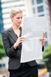 © EastWest Imaging - Woman with Newspapers