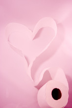 Heart Made Of Toilet Paper Isolated On The Pink Background.