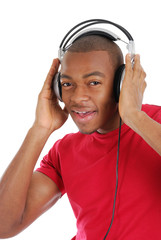Wall Mural - Young man listenning to music on headphones