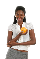 African american woman holding orange