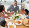 © WavebreakMediaMicro - Jolly family dining together