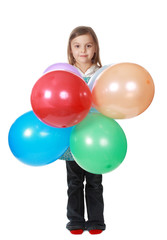 girl holding a bunch of balloons