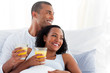 © WavebreakMediaMicro - Romantic couple drinking orange juice