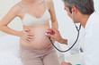 © WavebreakMediaMicro - Portrait of a pregnant woman examined by her gynecologist