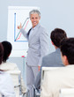 © WavebreakMediaMicro - Positive mature businessman doing a presentation