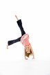 © Monkey Business - Young Girl In Gymnastic Pose Doing Cartwheel