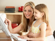 © Monkey Business - Mother And Daughter At Home Using Computer
