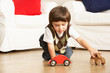 © Monkey Business - Young Boy Playing With Toy Cars At Home