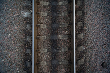 Rails And Cross Ties Of Railway Among Stones On Centre