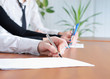 © Barone Rosso - person's hand signing an important document