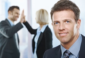 Canvas Print - Businessman smiling at camera