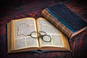 Two old books with glasses