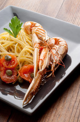 Poster - dish with scampi spaghetti vertical shoot