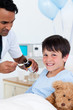 © WavebreakMediaMicro - Positive doctor giving medicine to a little boy