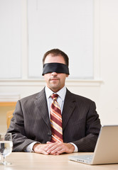 Wall Mural - Businessman in blindfold