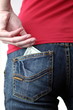 © lightpoet - Closeup of woman's bottom with banknotes in the pocket. (she is
