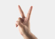 © gmf1000i - male hand with two fingers up in the peace or victory symbol