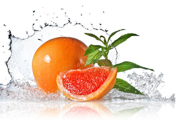 Wall Mural - Water splash on grapefruit with mint isolated on white