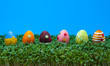 Row of easter eggs on cress