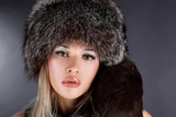 Fototapeta  - lovely young woman in winter fur hat