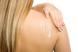 Fototapeta  - Causasian blonde woman creaming her back