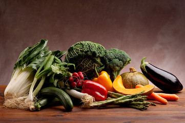 mix of vegetables on anciet wood frattino table