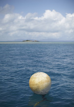 Buoy In The Sea Near The Island