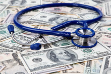 Costs Of Healthcare, Stethoscope And Dollar Bills