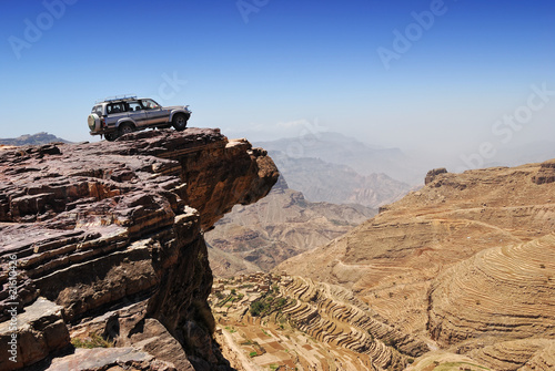 Naklejka na meble Lone car is standing on rock over breakaway